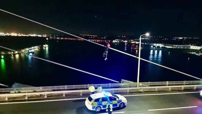 Two protesters climbed the bridge early on Monday