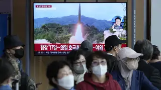 A TV screen shows a file image of North Korea's missile launch during a news programme at the Seoul Railway Station in South Korea on October 14 2022