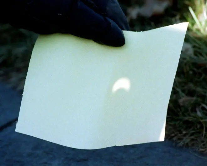 An image of an eclipse projected onto a piece of card using the pinhole method