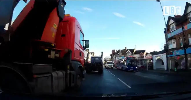 Lorry almost crashes into merging car