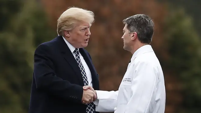 Donald Trump shakes hands with the White House doctor