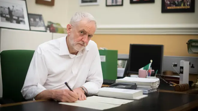Jeremy Corbyn signs his letter to Theresa May