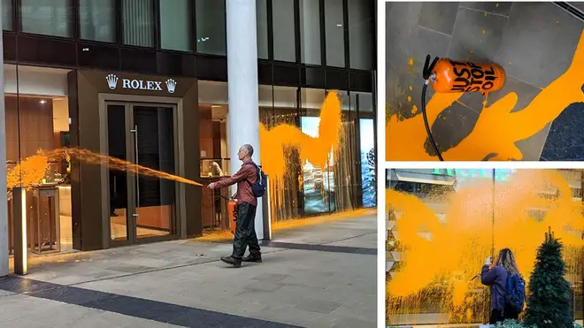 Two environmental have sprayed the front of Rolex's London store with orange paint from a fire extinguisher