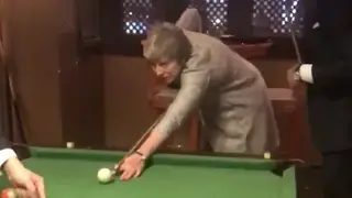 Theresa May tries her hand at pool with the Italian Prime Minister