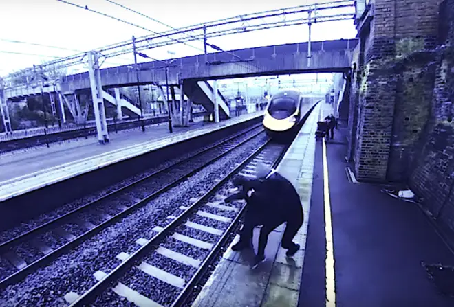 Brave woman saves man from jumping in front of train