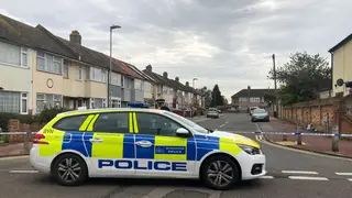 Police at the scene in Auriel Avenue, Dagenham where one woman died and another was injured in a double stabbing
