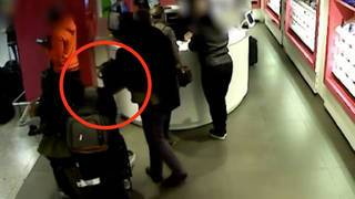 The brazen bag snatch was caught on CCTV inside Heathrow Airport