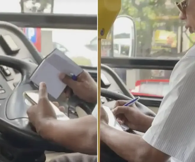 A bus driver was caught taking notes from a phone call whilst driving a packed bus