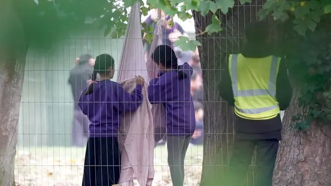 Children play inside the Manston immigration short-term holding facility