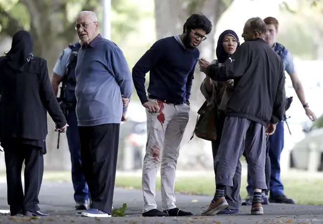 Survivors from the Mosque shooting with blood on their clothes