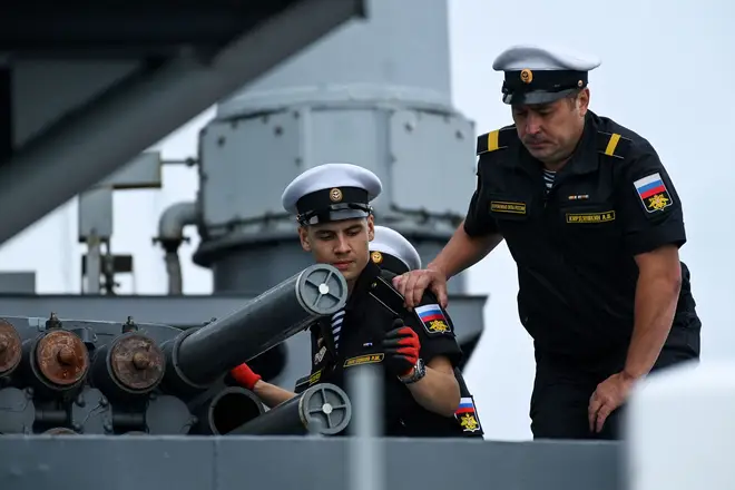 Russian sailors onboard an anti-submarine destroyer