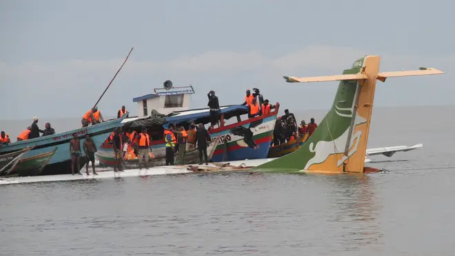 Rescuers search for survivors after the Precision Air flight that was carrying 43 people plunged into Lake Victoria