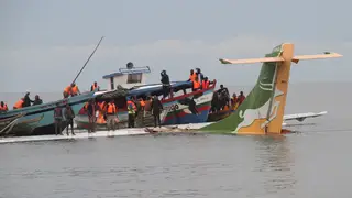 Rescuers search for survivors after the Precision Air flight that was carrying 43 people plunged into Lake Victoria