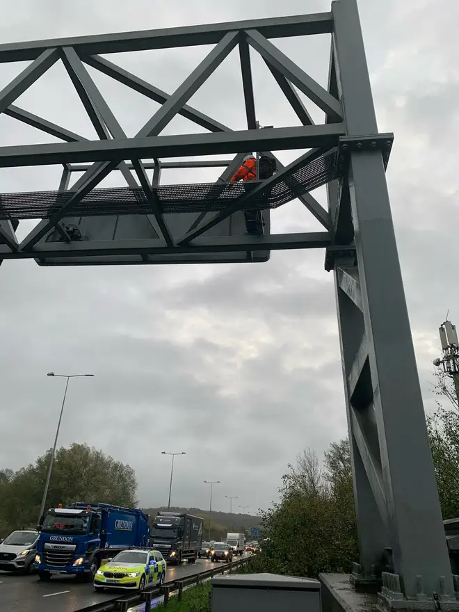 Protesters climbed overhead gantries on the M25 on Monday