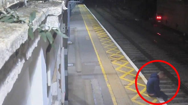 Man narrowly avoids hitting a train