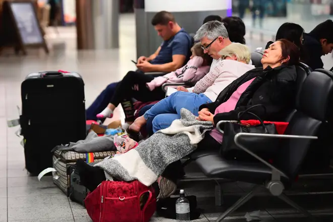 Passengers sleeping at Gatwick airport which was closed for several days following drone sightings over the airfield.