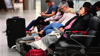 Passengers sleeping at Gatwick airport which was closed for several days following drone sightings over the airfield.