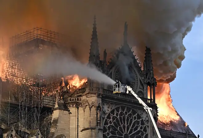Firefighters tackle the blaze as Notre Dame cathedral burns
