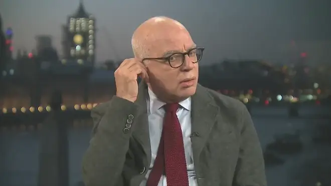 Michael Wolff fiddles with his earpiece