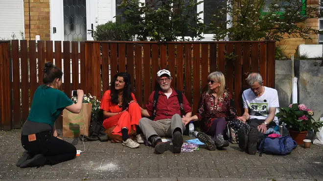 Four protesters have glued themselves to Jeremy Corbyn's house