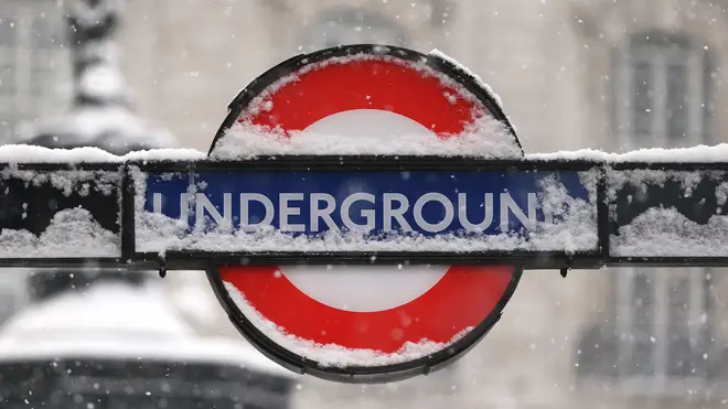London Underground sign covered in snow