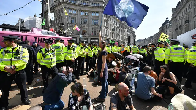Police officers at Oxford Circus amongst the Extinction Rebellion protesters