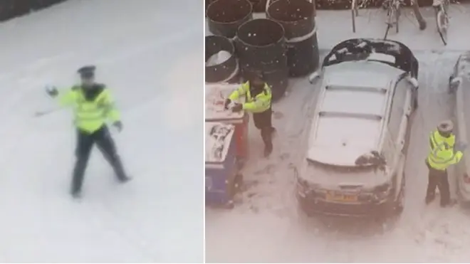 Police officers having a snowball fight