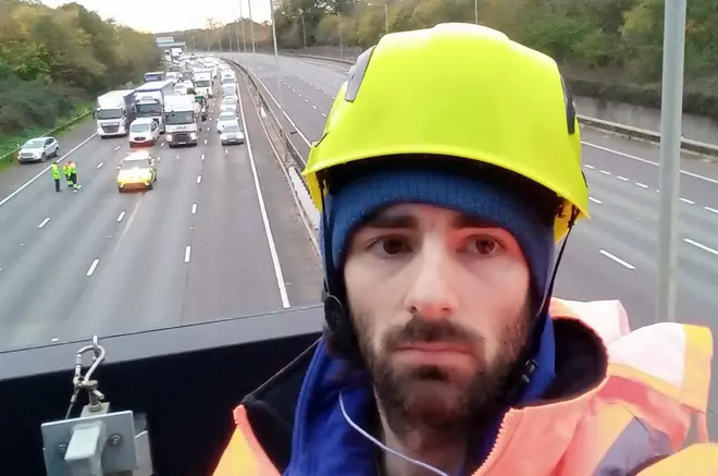 Protesters have climbed overhead gantries on the M25