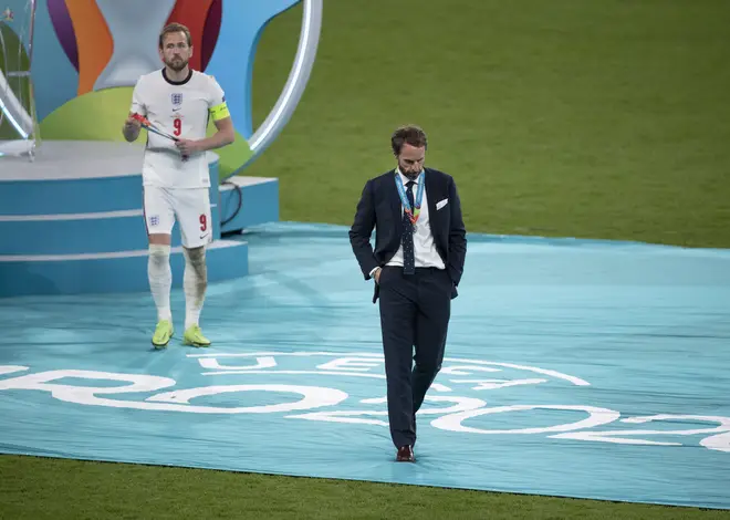 Gareth Southgate and captain Harry Kane walk off after losing the Euro 2020 final