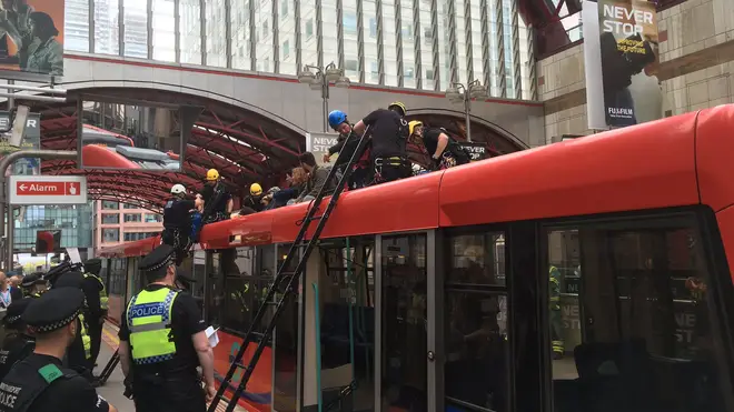 Five protesters were arrested at the DLR this morning