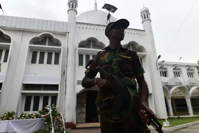 A soldier guards a mosque that had been used as a shelter by Muslims fearing reprisals following the Easter Sunday attacks.