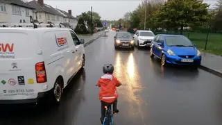 The 5-year-old boy cycles home and a car approaching doesn't slow down or stop