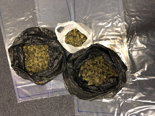 Police showed bin bags filled with drugs.