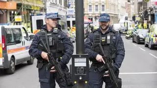 Armed police guard the crime scene in the aftermath of the attacks on London Bridge and Borough Market.