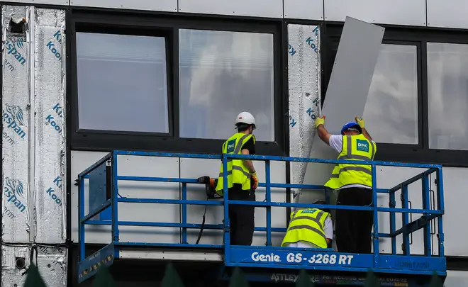 Cladding is removed from Whitebeam Court, in Pendleton, Greater Manchester.