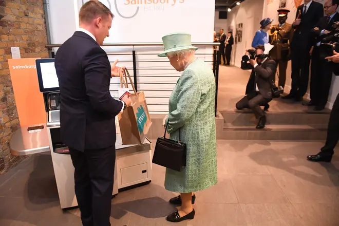 The Queen was shown how to use a self-service checkout.
