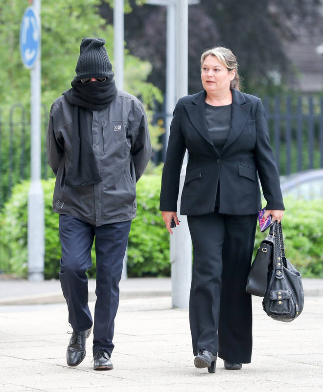 Higgins arrived at court attempting to conceal his identity.
