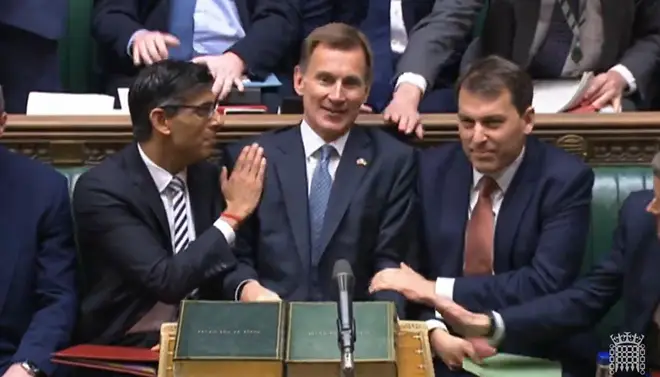 Rishi Sunak congratulates the Chancellor after he delivered the Autumn Statement