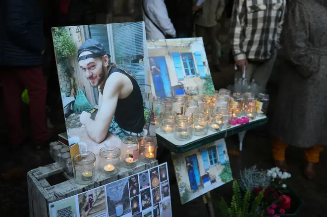 Portraits and candles are displayed during a white march to pay tribute to Morgan Keane