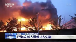 In this image taken from video footage run by China's CCTV, an industrial wholesaler burns in Anyang in central China's Henan province