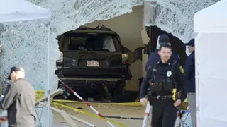 The SUV inside the Apple store after the crash
