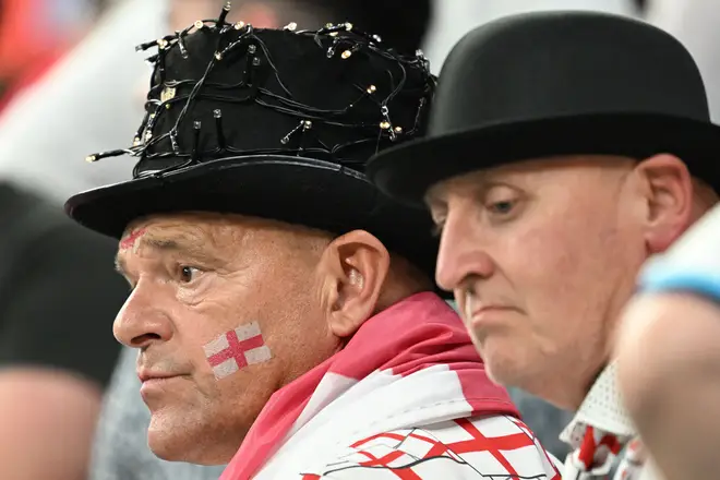 England supporters look dejected after the Qatar 2022 World Cup Group B football match between England and USA