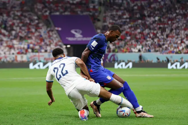 Haji Wright of United States and Jude Bellingham of England compete for the ball