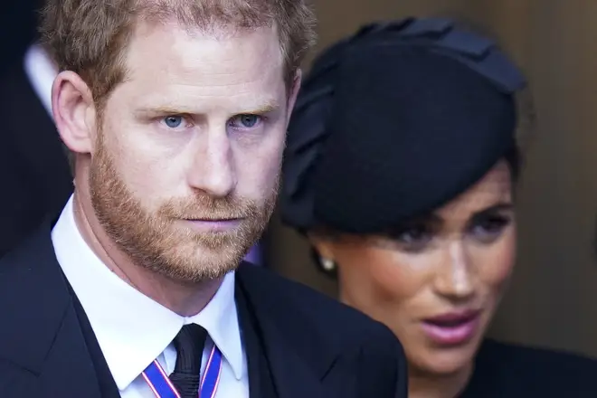 Meghan and Harry are pictured at the Queen's state funeral in September