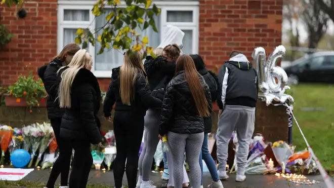 People pay tribute at the scene in Abbey Wood, Thamesmead