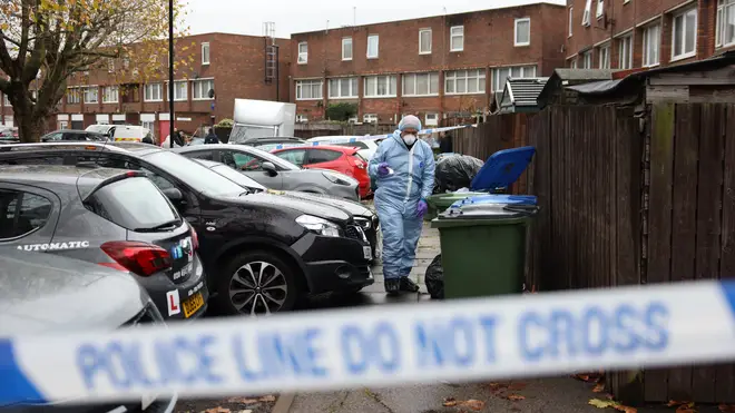 Forensic officers probe the scene on Sewell Road today