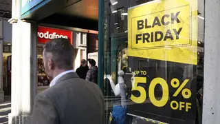 A Black Friday poster in a shop window
