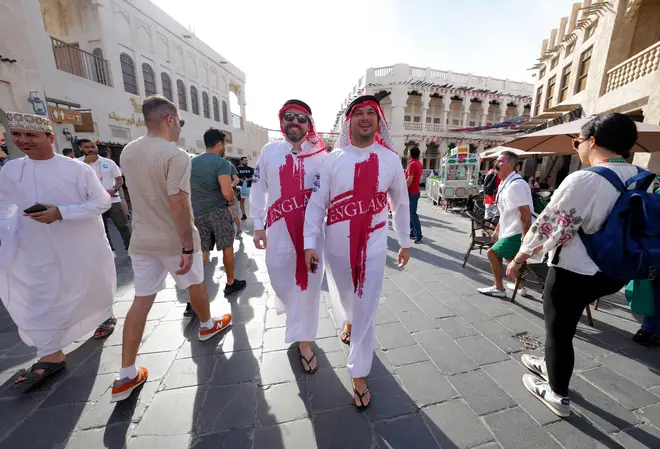 England fans pose for a photograph at a souq in Doha this week