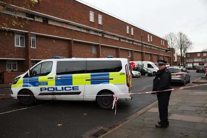 A Metropolitan Police officer at the scene of a stabbing on Titmuss Avenue in Thamesmead