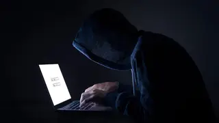 A hacker performing a cyber attack
